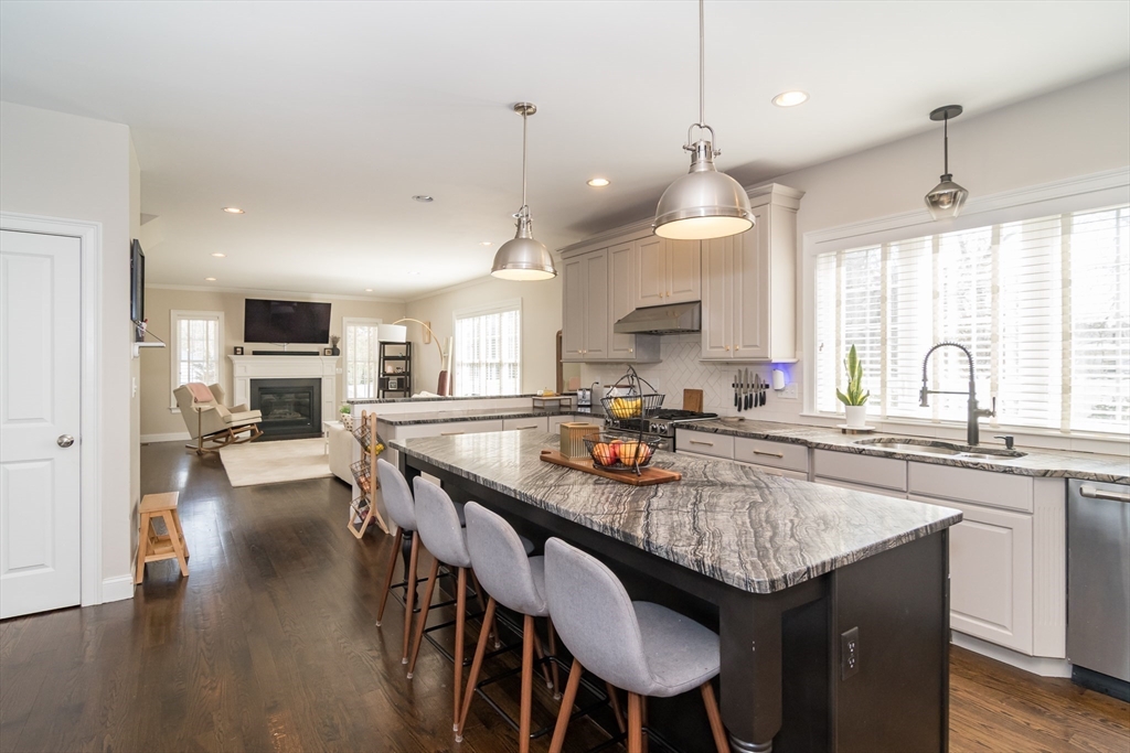 6 Hickory Road Natick, MA 01760 - Photo 10 of 35 a kitchen with sink a center island and furniture