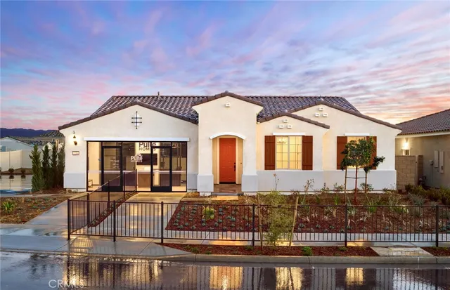 a front view of house with yard and outdoor seating