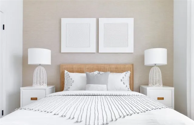 a bedroom with a bed and a lamp