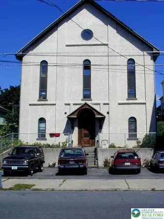 a car parked in front of a house