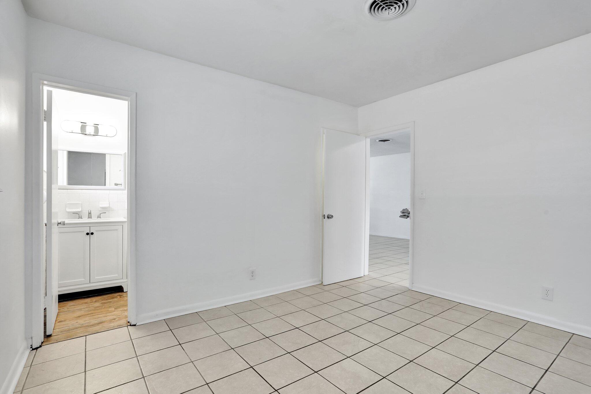 2540-2550 Northeast 10th Court, Unit 12 Pompano Beach, FL 33062 - Photo 18 of 25 a view of an empty room and window