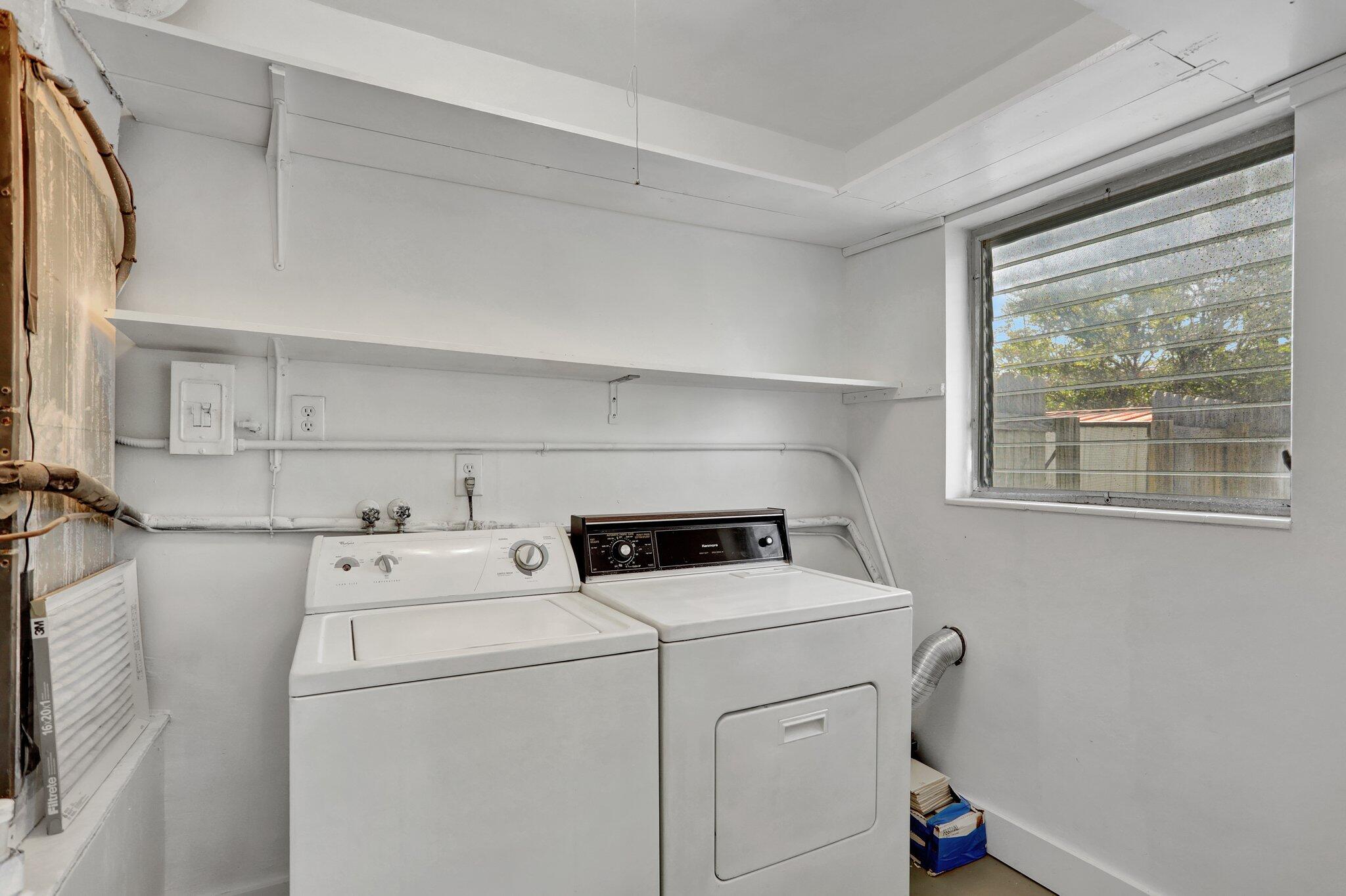 2540-2550 Northeast 10th Court, Unit 12 Pompano Beach, FL 33062 - Photo 24 of 25 a utility room with dryer and washer