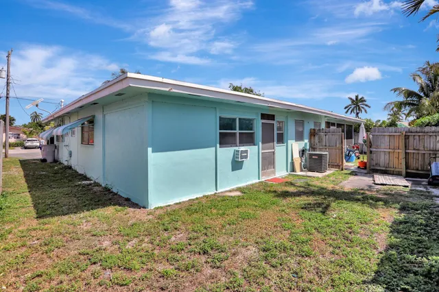 a backyard of a house with seating space