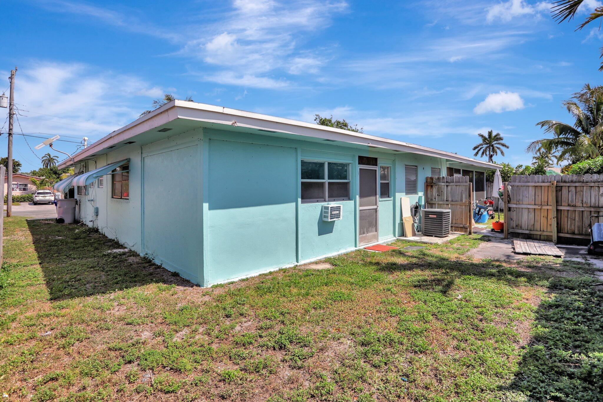 2540-2550 Northeast 10th Court, Unit 12 Pompano Beach, FL 33062 - Photo 25 of 25 a backyard of a house with seating space