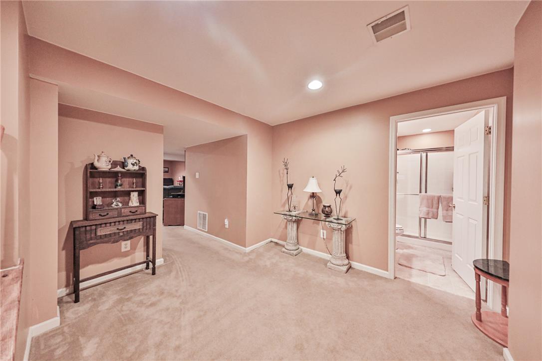 138 Clover Hollow Road Easton, PA 18045 - Photo 75 of 95 A well-lit recreational space featuring plush carpeting and convenient access to a full bathroom.