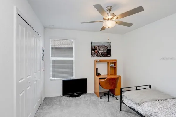 a living room with furniture and a rug