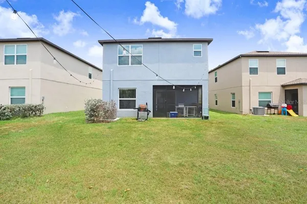 a view of an house with backyard and kitchen