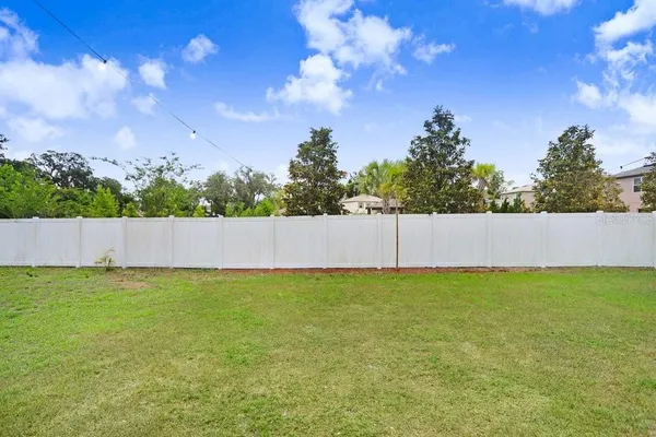a view of empty space with swimming pool and outdoor seating