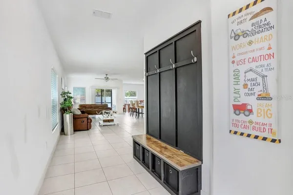 a kitchen with stainless steel appliances a refrigerator and a stove top oven