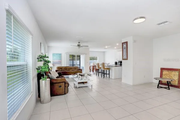 a view of a livingroom with furniture and a potted plant
