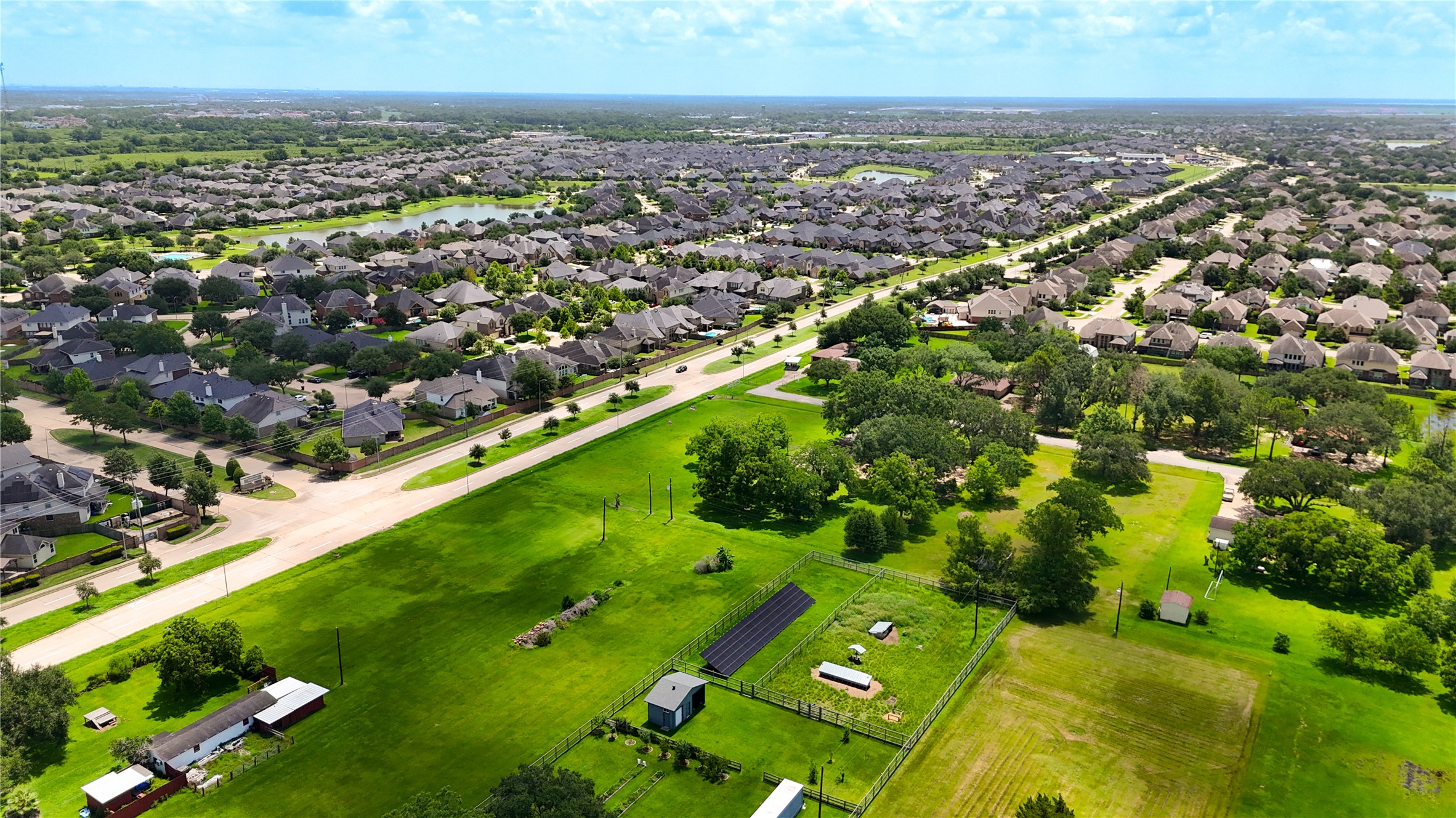 602 Sycamore Road Richmond, TX 77469 - Photo 20 of 22 an aerial view of residential houses with outdoor space and trees