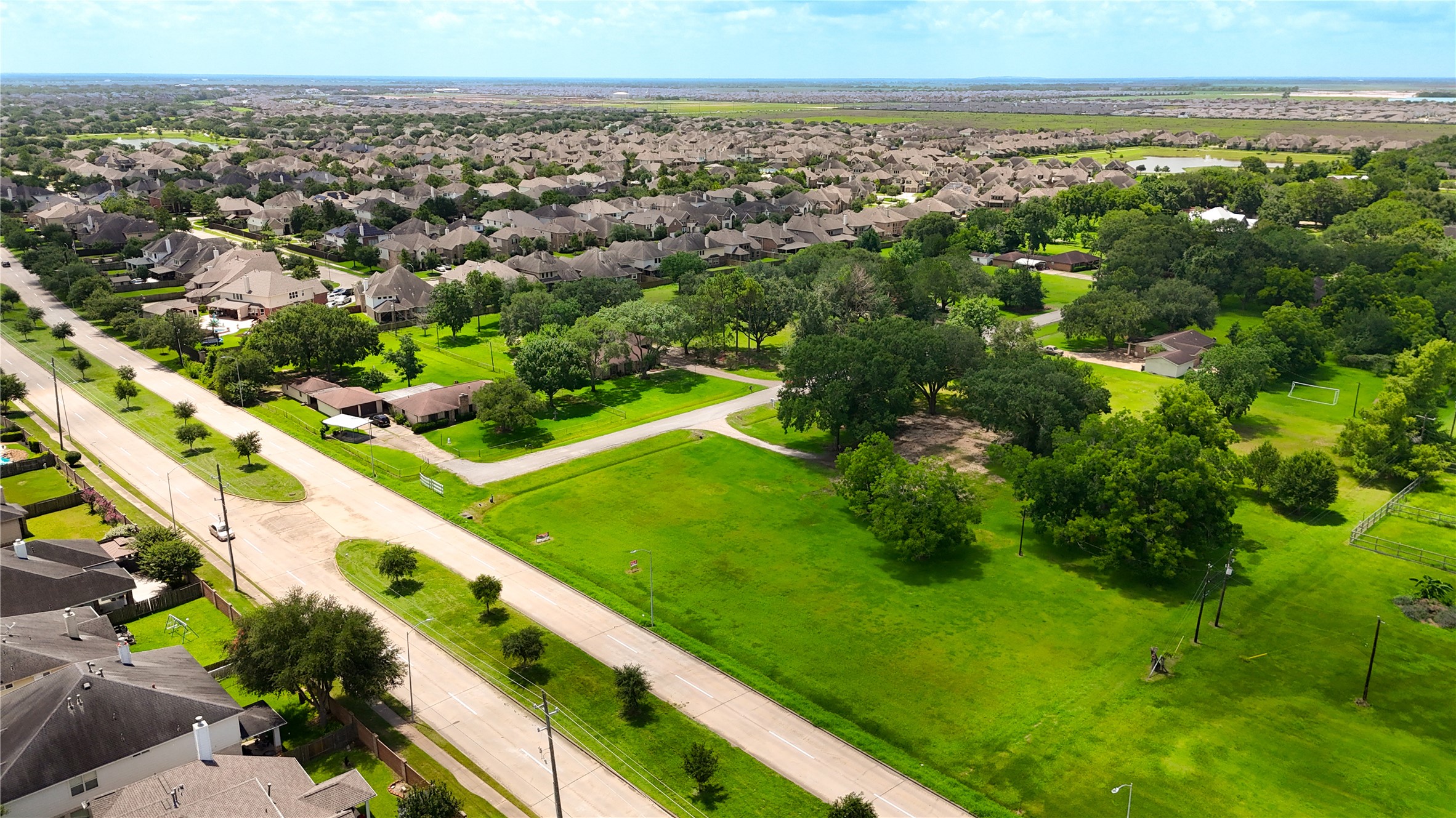 602 Sycamore Road Richmond, TX 77469 - Photo 7 of 22 an aerial view of residential houses with outdoor space and trees