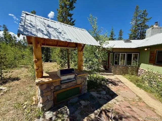 a view of a patio with a table and chairs