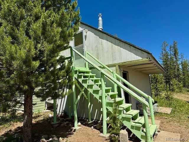 a view of a chairs in wooden deck