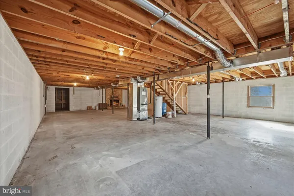 a view of empty room with wooden ceiling