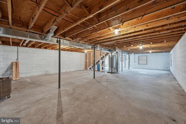 a view of empty room with wooden ceiling