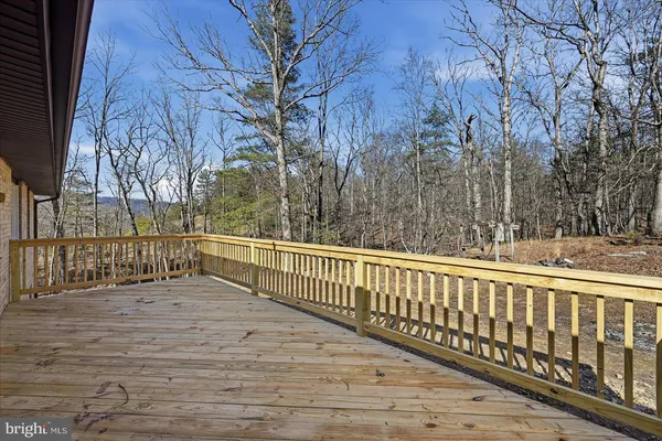 a view of a balcony with trees