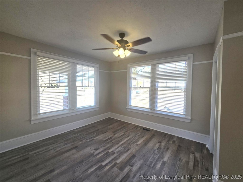 802 Dunn Road Fayetteville, NC 28312 - Photo 12 of 28 a view of an empty room with a window and a fan