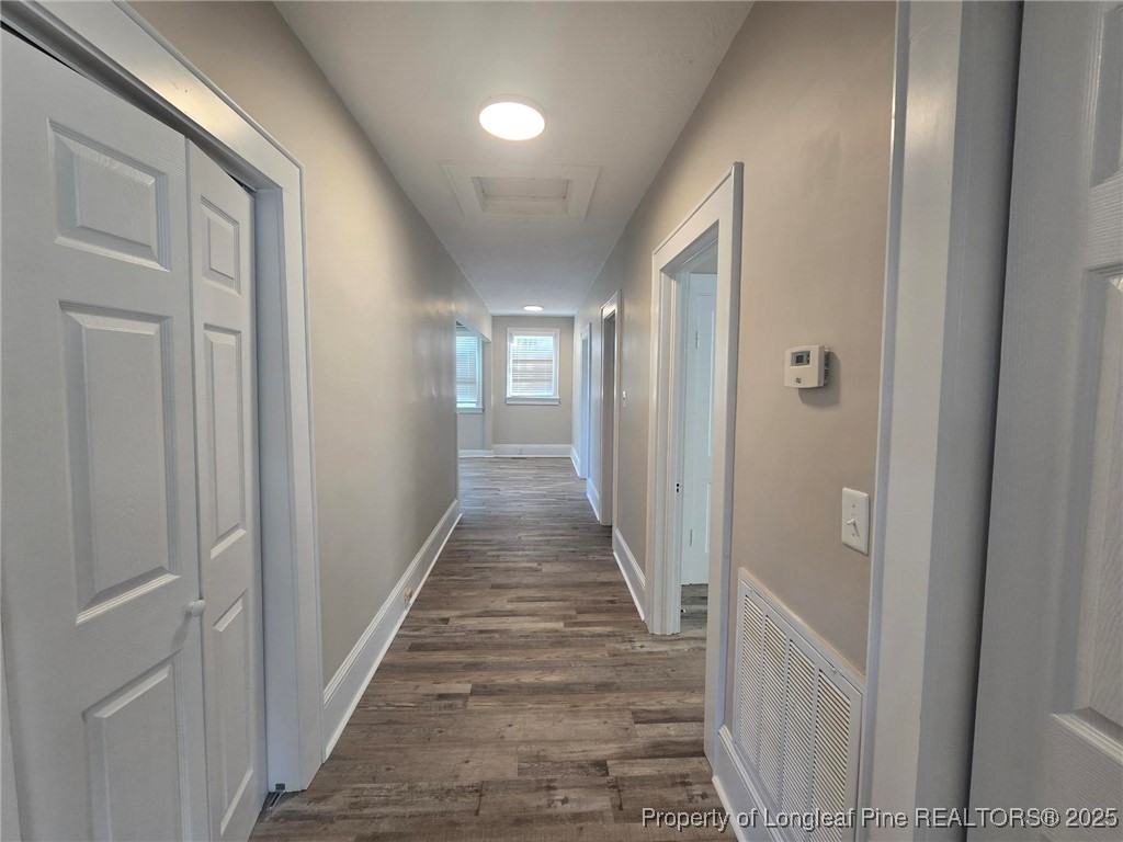 802 Dunn Road Fayetteville, NC 28312 - Photo 18 of 28 a view of a hallway with a wooden door
