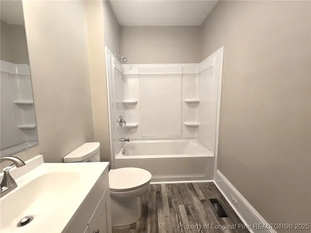 a bathroom with a toilet a sink and bathtub