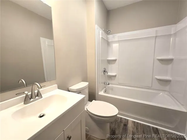 a bathroom with a sink a toilet and a bathtub