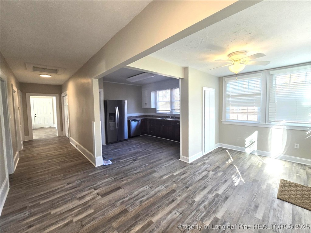 802 Dunn Road Fayetteville, NC 28312 - Photo 27 of 28 a view of a big room with wooden floor and windows