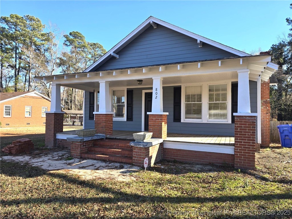 802 Dunn Road Fayetteville, NC 28312 - Photo 4 of 28 a front view of a house with garden