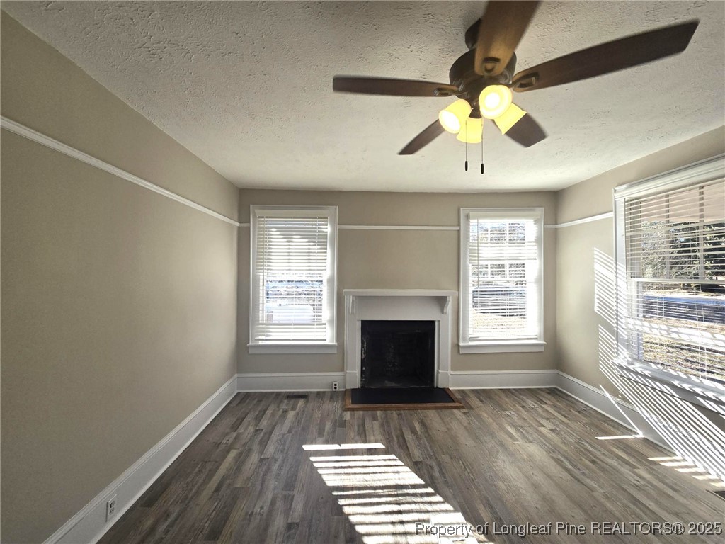 802 Dunn Road Fayetteville, NC 28312 - Photo 7 of 28 a view of an empty room with window and chandelier fan