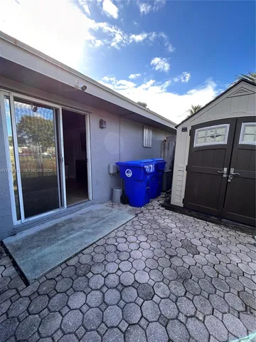 a backyard of a house with seating space