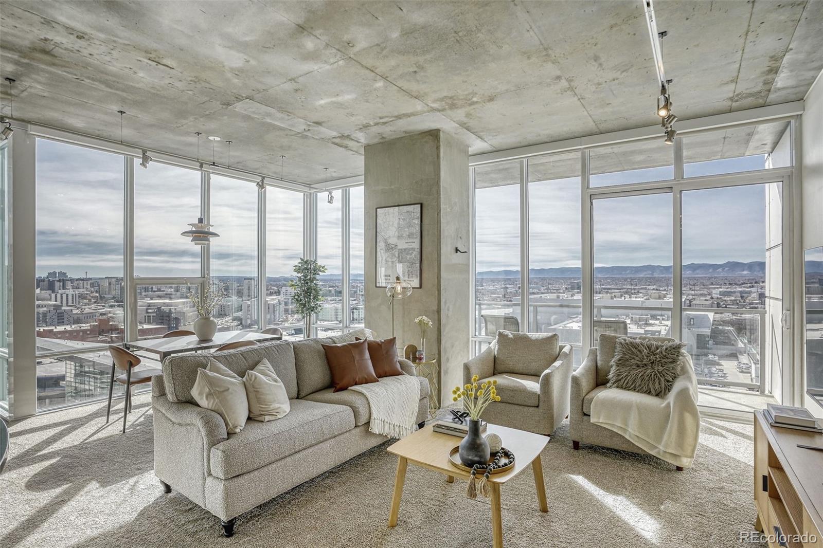 891 14th Street, Unit 1917 Denver, CO 80202 - Photo 1 of 29 a living room with furniture and floor to ceiling windows