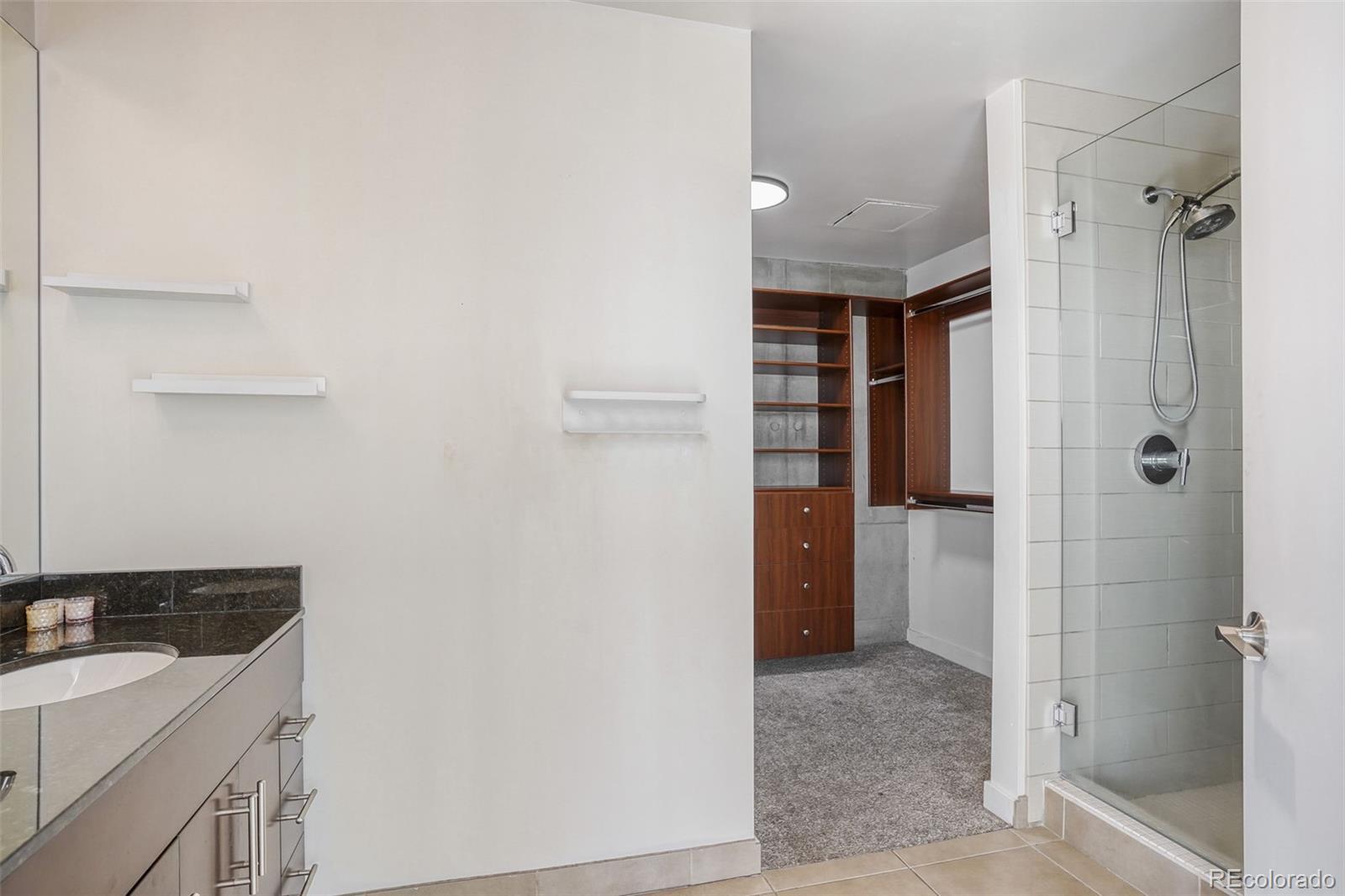 891 14th Street, Unit 1917 Denver, CO 80202 - Photo 16 of 29 a bathroom with a sink and a shower