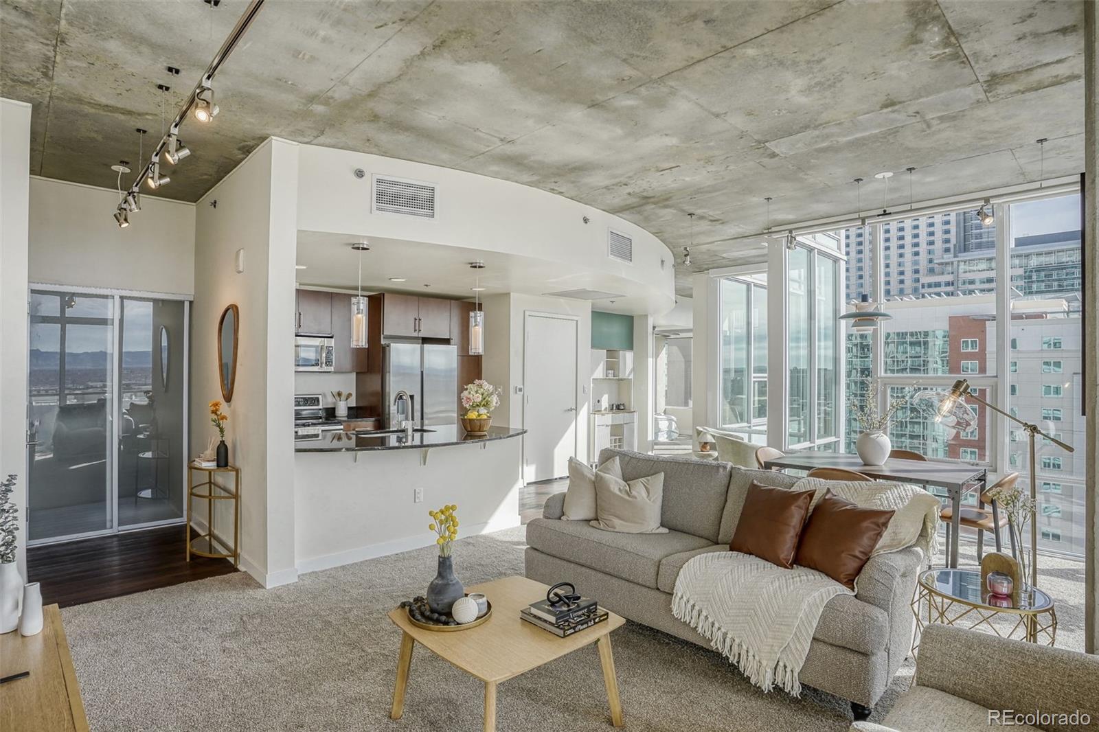 891 14th Street, Unit 1917 Denver, CO 80202 - Photo 3 of 29 a living room with furniture and a large window
