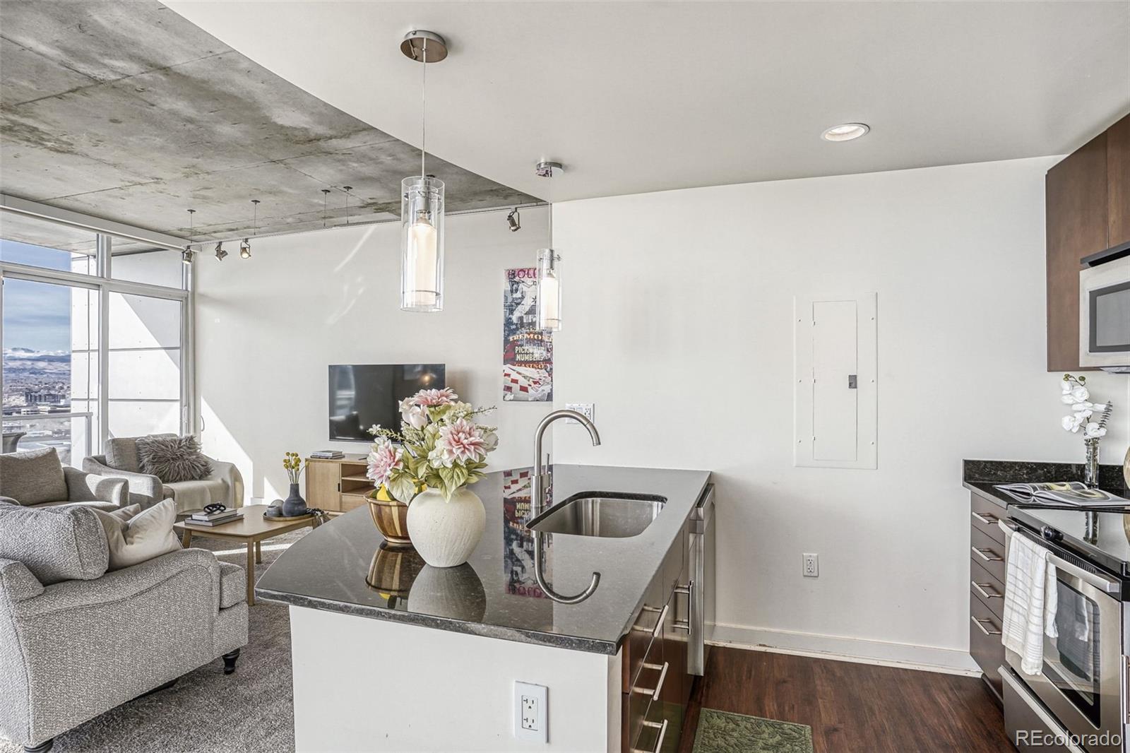 891 14th Street, Unit 1917 Denver, CO 80202 - Photo 9 of 29 a kitchen with a table and chairs