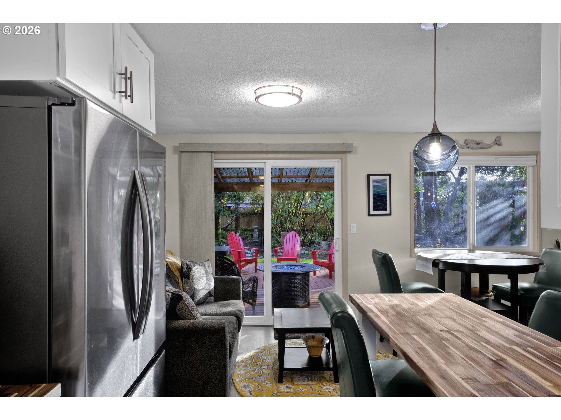 2060 20th Street Florence, OR 97439 - Photo 22 of 37 a dining room with furniture a chandelier and wooden floor