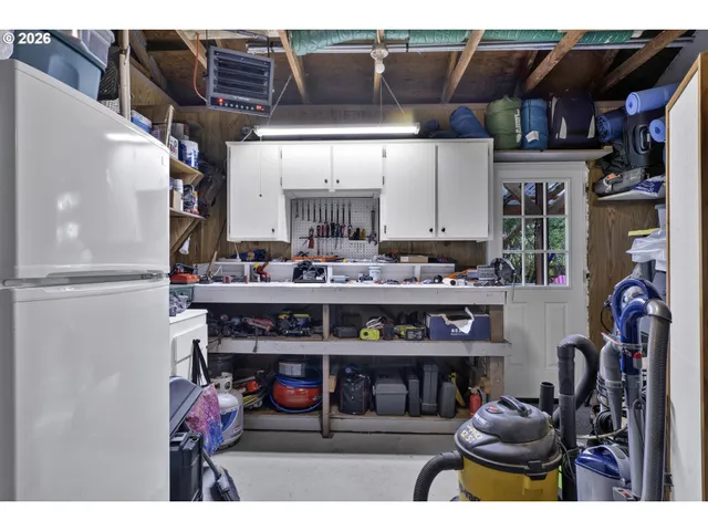 a view of storage and utility room with washer and dryer