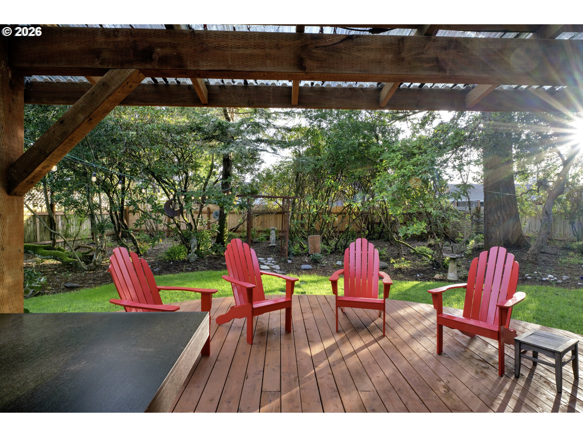 2060 20th Street Florence, OR 97439 - Photo 29 of 37 a view of a table and chairs in patio