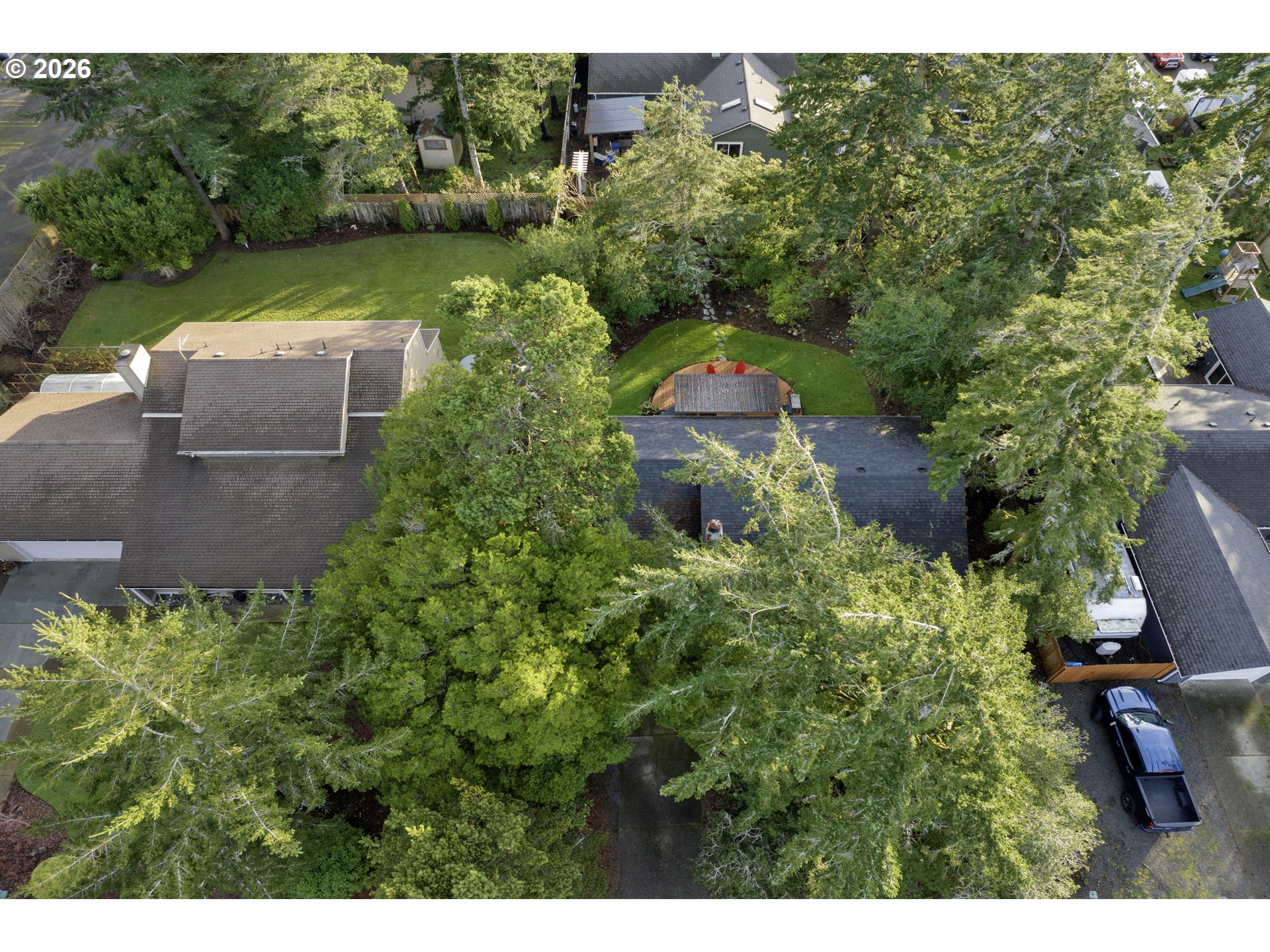 2060 20th Street Florence, OR 97439 - Photo 34 of 37 a view of a garden with lawn chairs