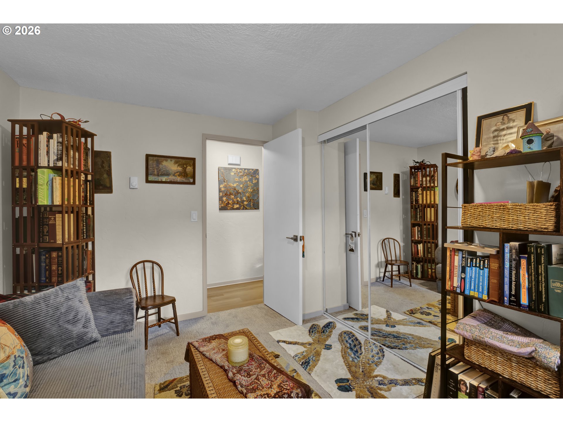 2060 20th Street Florence, OR 97439 - Photo 10 of 37 a living room with furniture and a book shelf