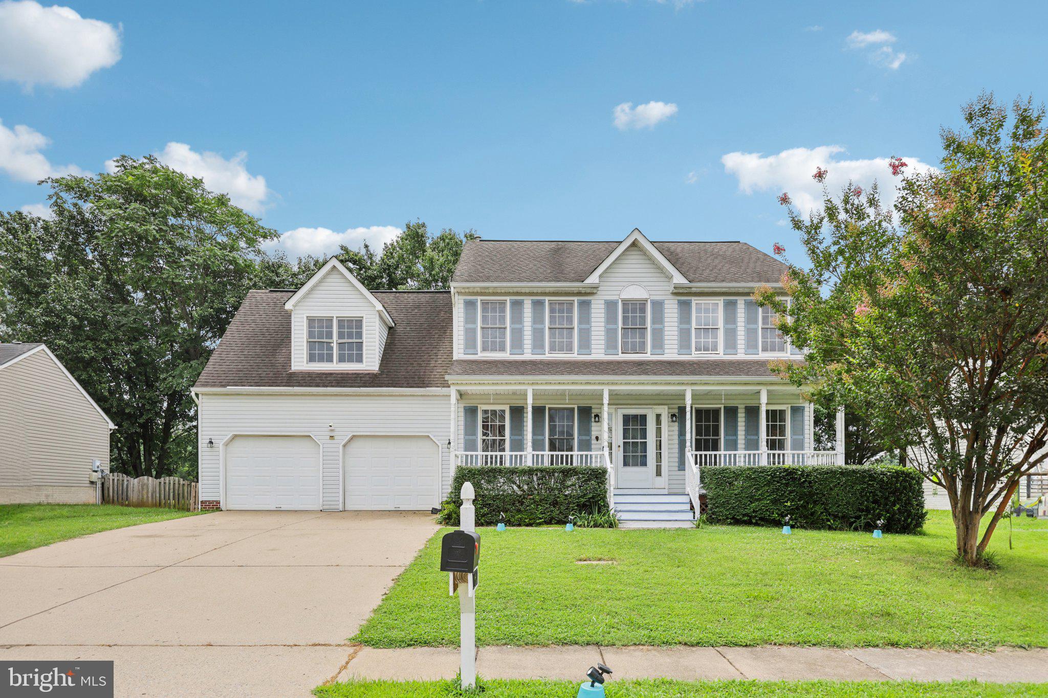 11607 River Meadows Way Fredericksburg, VA 22408 - Photo 2 of 67 a front view of a house with a garden and yard
