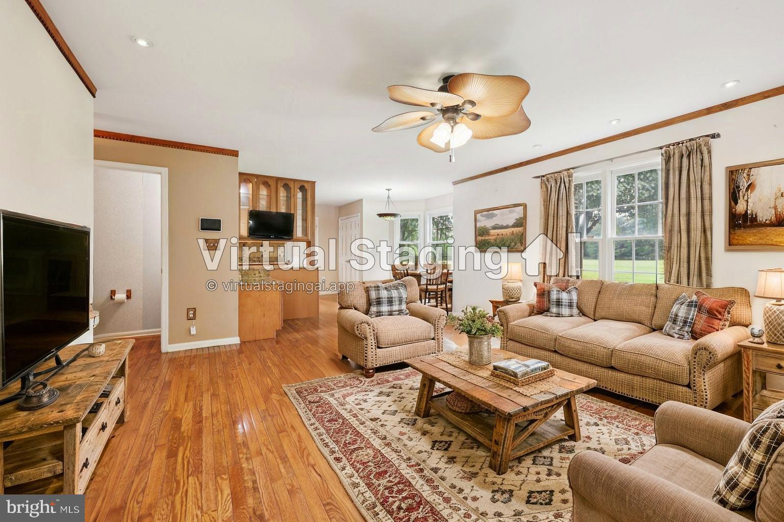 11607 River Meadows Way Fredericksburg, VA 22408 - Photo 22 of 67 a living room with furniture and a flat screen tv