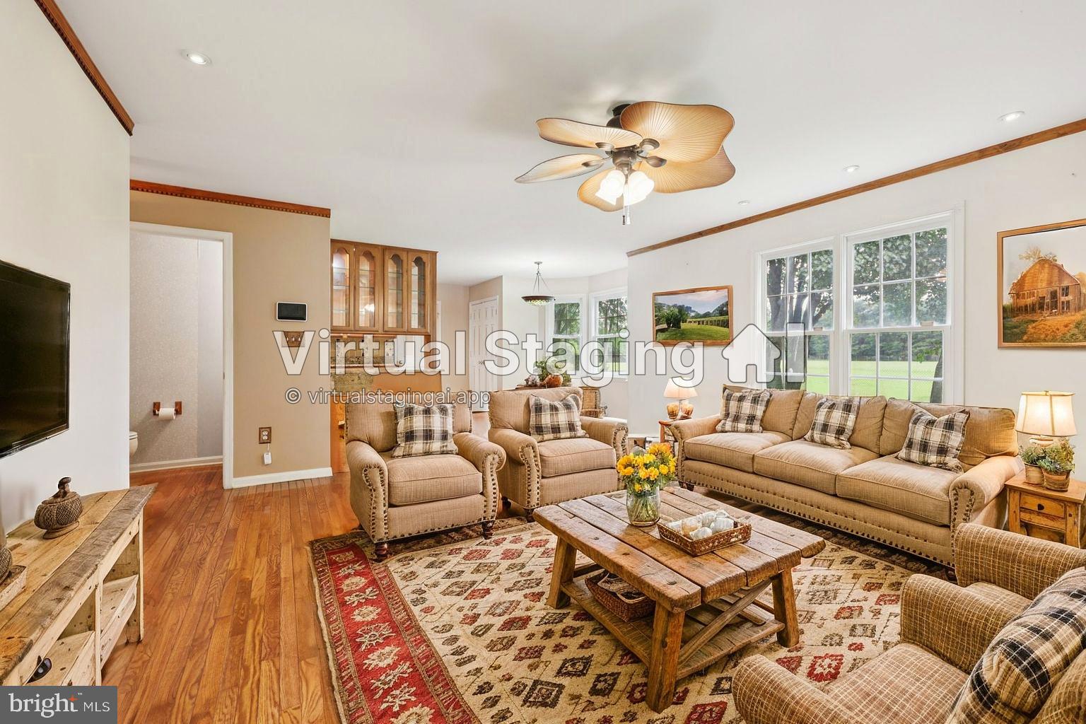 11607 River Meadows Way Fredericksburg, VA 22408 - Photo 23 of 67 a living room with furniture and a flat screen tv