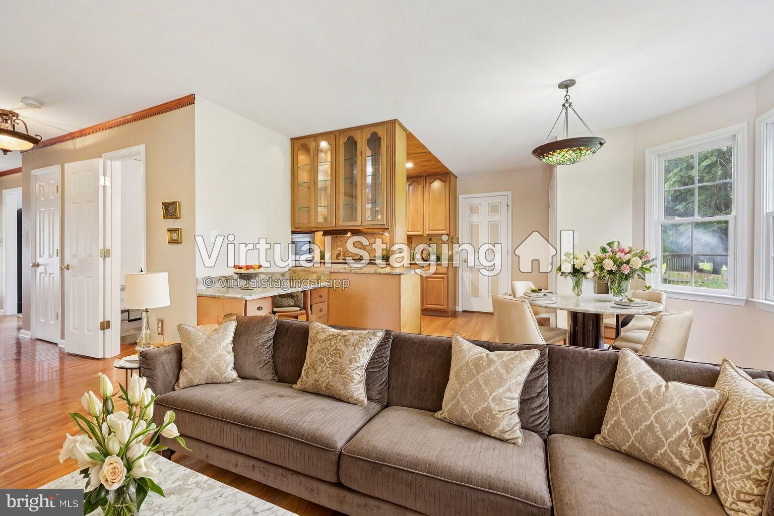 11607 River Meadows Way Fredericksburg, VA 22408 - Photo 26 of 67 a living room with furniture and a chandelier