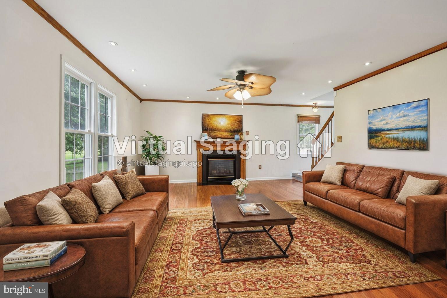 11607 River Meadows Way Fredericksburg, VA 22408 - Photo 28 of 67 a living room with furniture and a flat screen tv