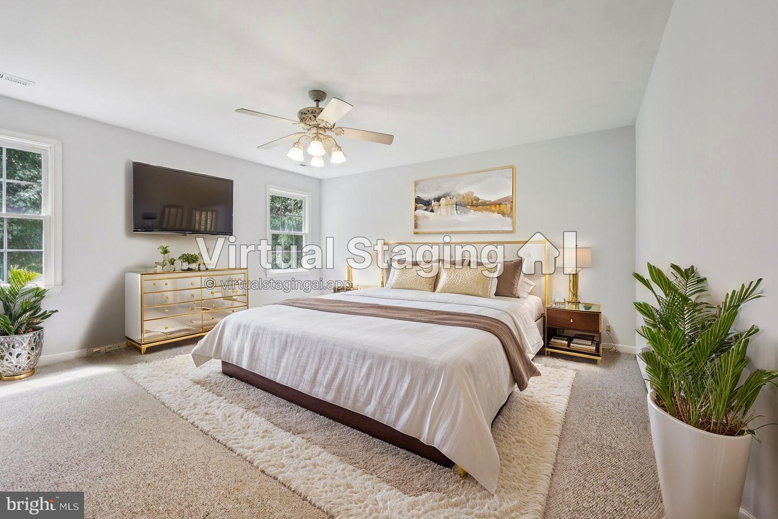 11607 River Meadows Way Fredericksburg, VA 22408 - Photo 30 of 67 a bedroom with a bed and a flat screen tv