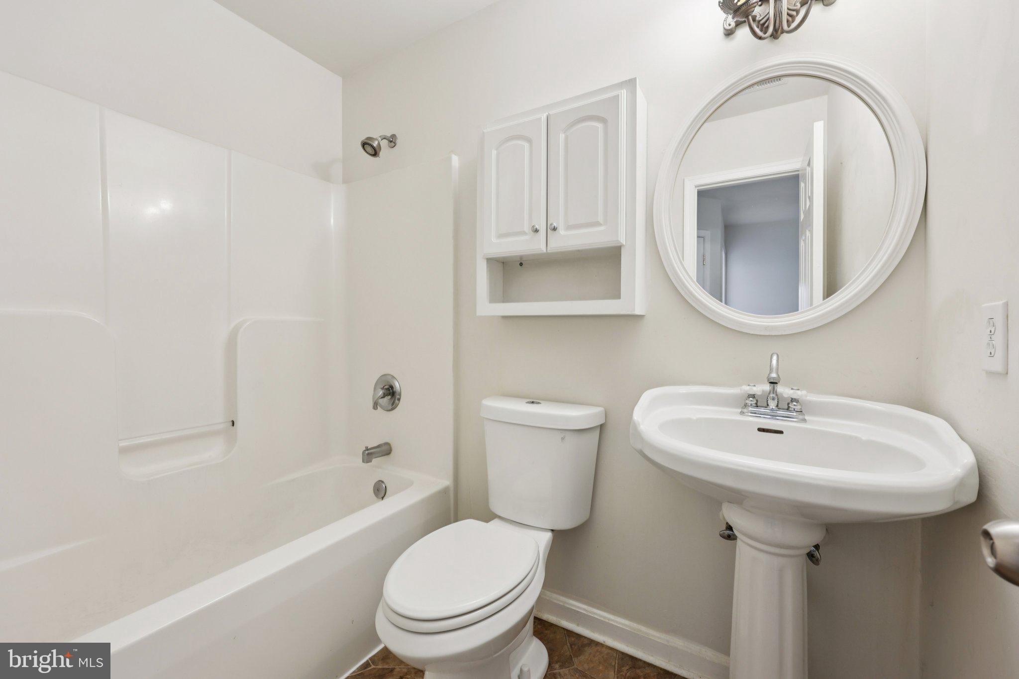 11607 River Meadows Way Fredericksburg, VA 22408 - Photo 47 of 67 a bathroom with a sink a toilet and a mirror