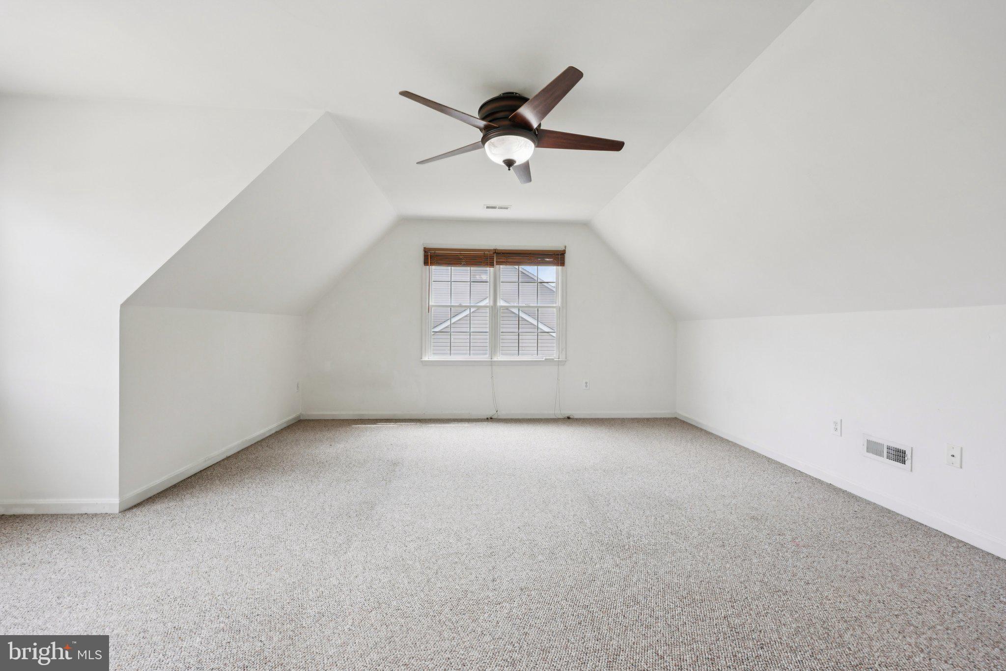 11607 River Meadows Way Fredericksburg, VA 22408 - Photo 49 of 67 an empty room with windows and ceiling fan