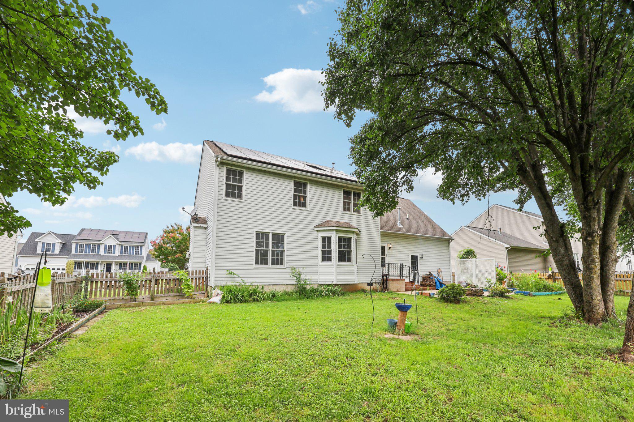 11607 River Meadows Way Fredericksburg, VA 22408 - Photo 56 of 67 a front view of house with yard and green space