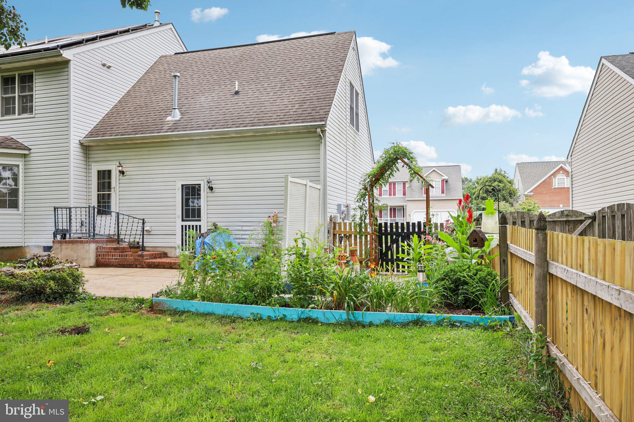 11607 River Meadows Way Fredericksburg, VA 22408 - Photo 57 of 67 a front view of house with yard and green space