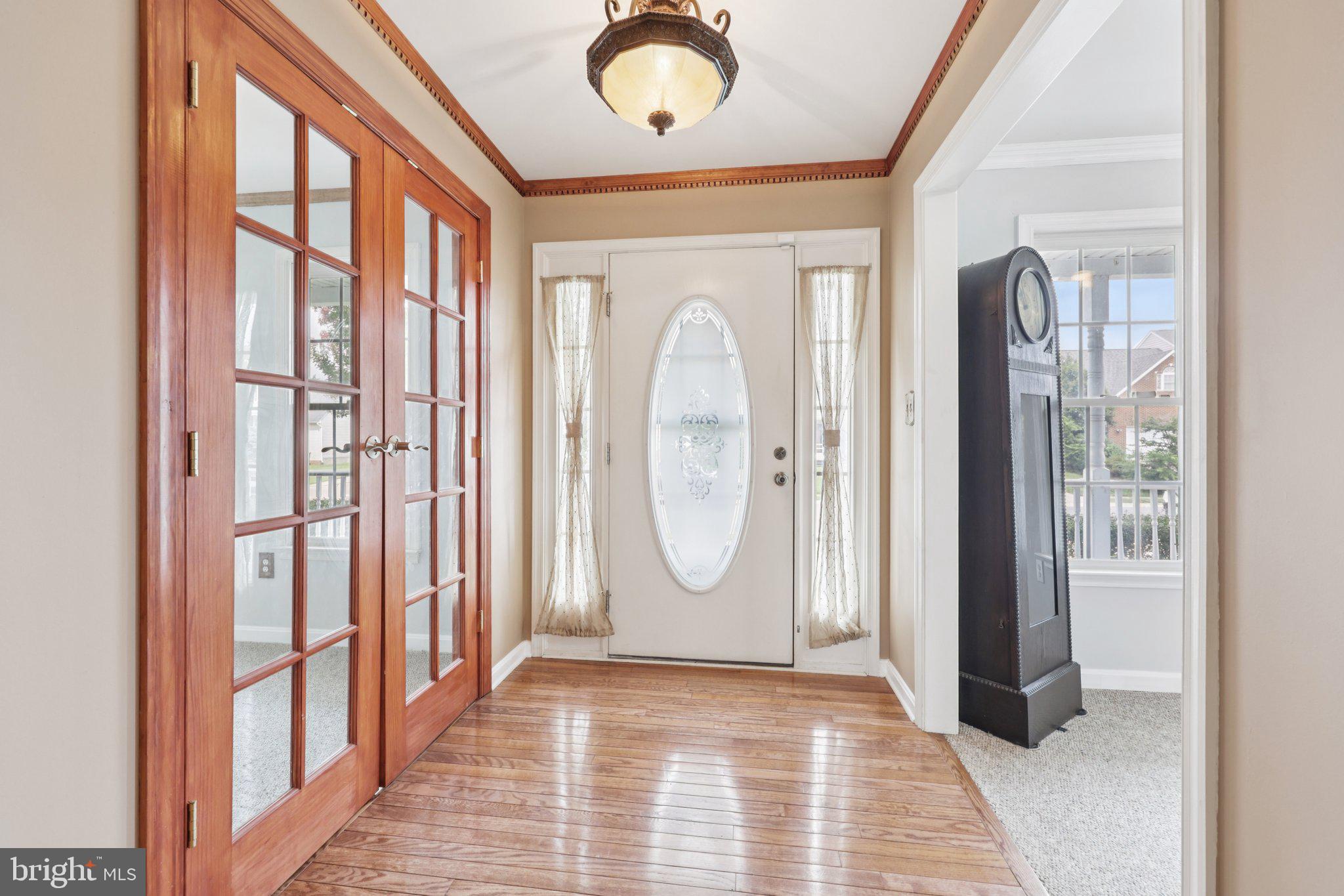 11607 River Meadows Way Fredericksburg, VA 22408 - Photo 7 of 67 a view of a livingroom with wooden floor and a large window