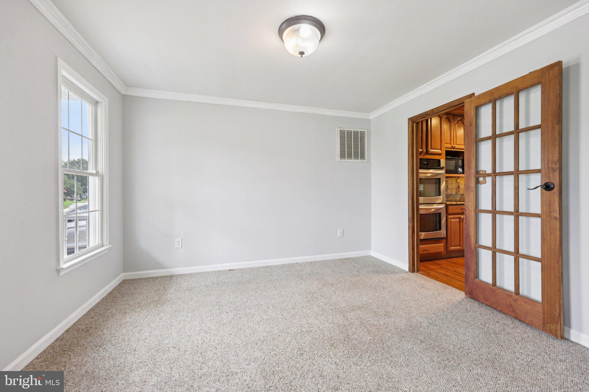 11607 River Meadows Way Fredericksburg, VA 22408 - Photo 10 of 67 a view of an empty room with a window